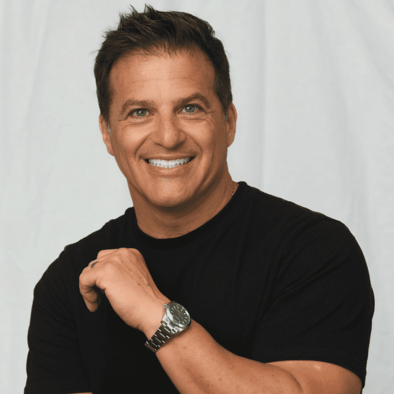 Portrait of Michael Tsakiris, a professional stylist at Michael Anthony Salon, showcasing their expertise and style.