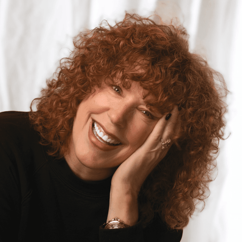 Portrait of Cory Devlin, a professional stylist at Michael Anthony Salon, showcasing their expertise and style.