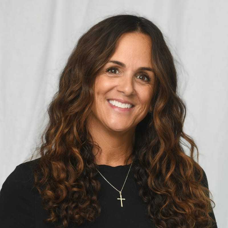 Portrait of Sharon Tsakiris, a professional stylist at Michael Anthony Salon, showcasing their expertise and style.